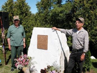 Ardoch Algonquin founder Harold Perry and his brother Neil at the plaque commemnorating the wild rice war of 1979.